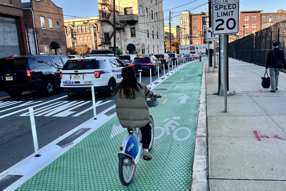 Green bike lane with flexible delineators and textures paint in Hoboken, New Jersey
